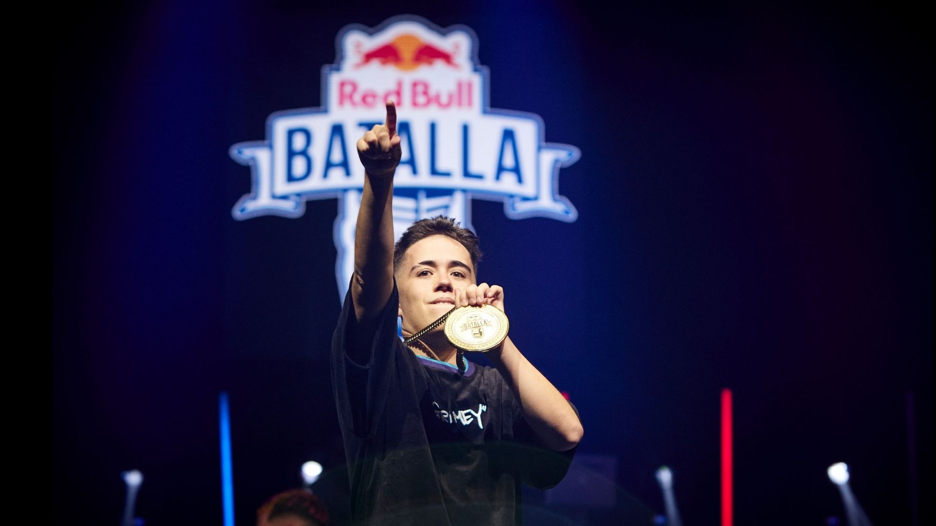 Champion pointing skyward with the Batalla medal